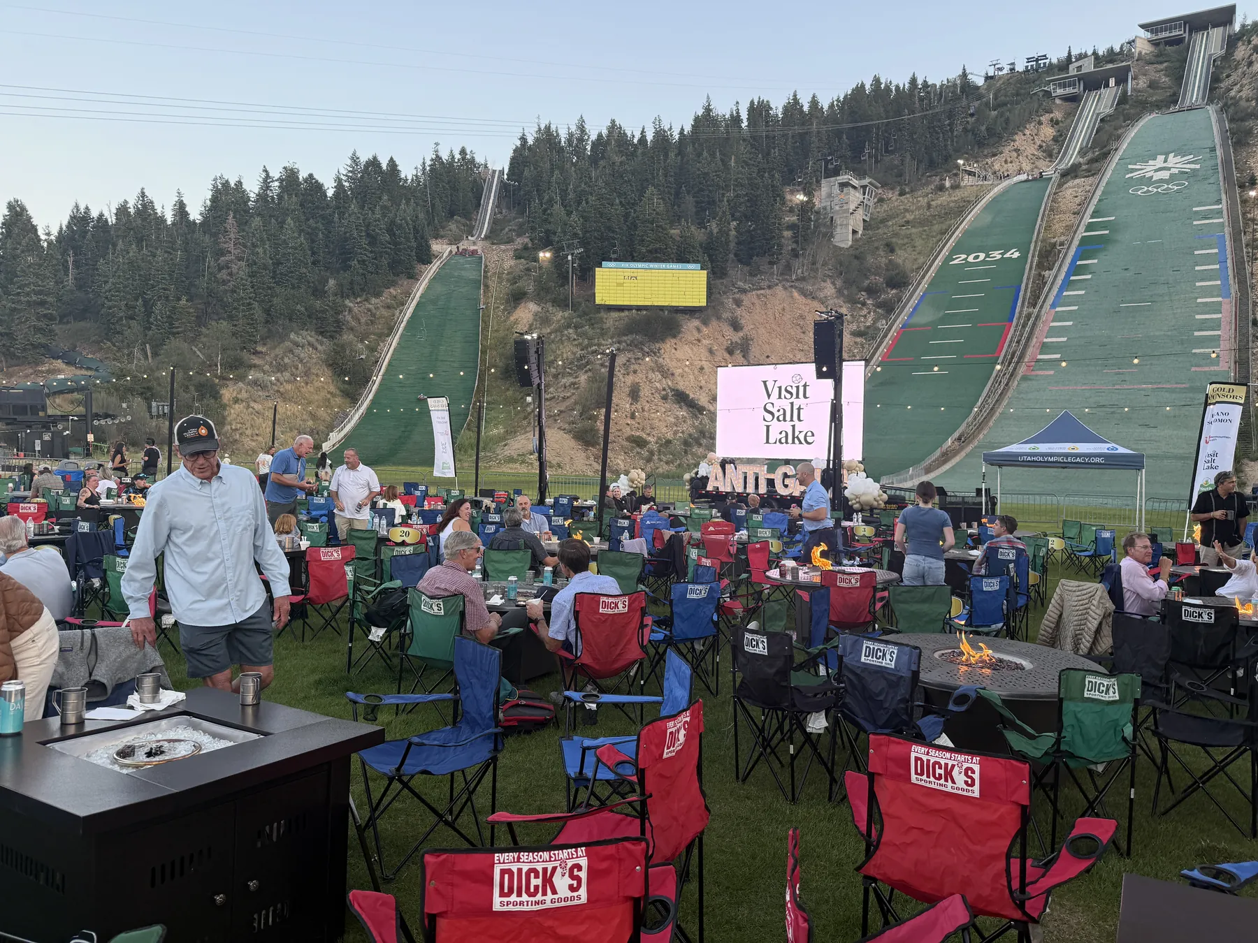 Destination event production at Utah Olympic Park with a sound system, screen, and seated audience below the ski jumps