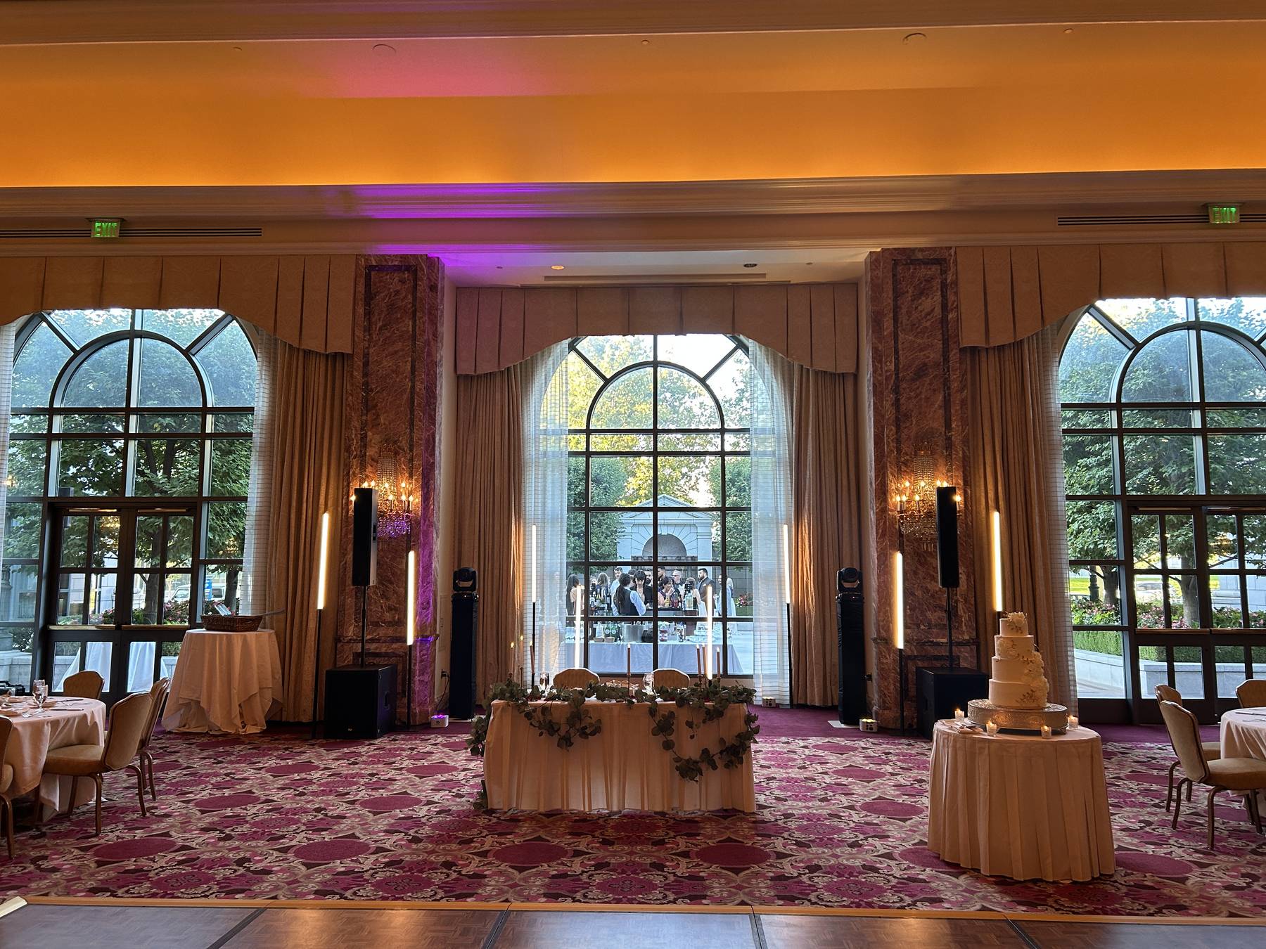 Ornate Grand America ballroom with drapery set for a formal event